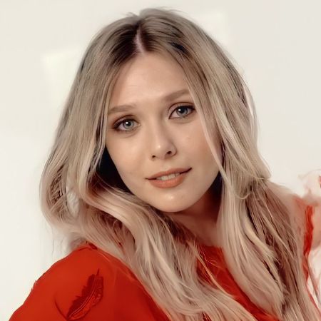 Elizabeth Olsen posing for a picture in a red dress